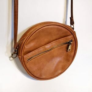 Antik Kraft round carmel brown crossbody bag.
